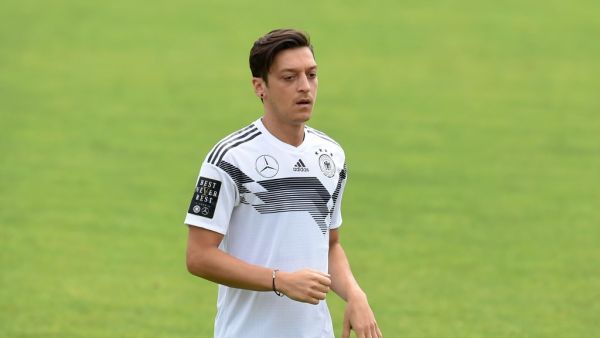 The midfielder confirmed he won't be going back on his decision to retire from international football after being unveiled at Fenerbahce (Photo: AFP)