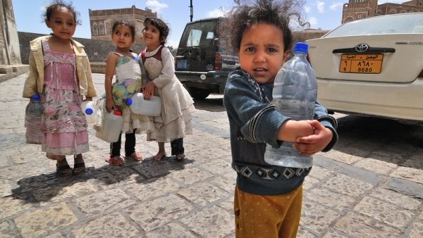 Unidentified girls with empty water-pots going in search of drinking water in Sana, Yemen. (Shutterstock/ File Photo)