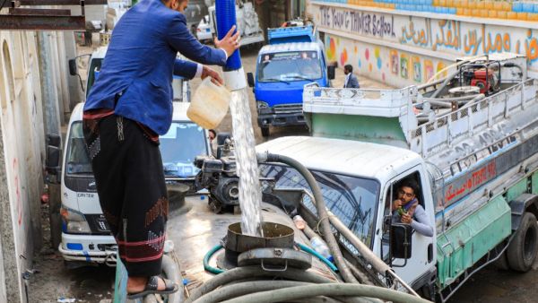 A man fills up a water tanker truck from a tap in Yemen's Huthi rebel-held capital Sanaa on January 23, 2021. Mohammed HUWAIS / AFP