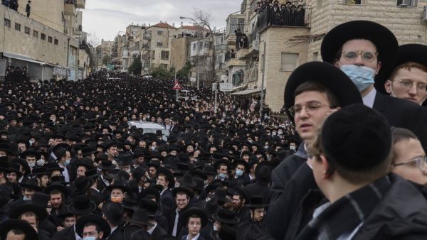 Thousands of Ultra-Orthodox Jews attend a funeral procession for the Head of the Brisk Yeshiva, Rabbi Meshulam Dovid Soloveitchik in Jerusalem on January 31, 2021, following his passing aged 99 due to months-long illness compounded by the coronavirus. MENAHEM KAHANA / AFP