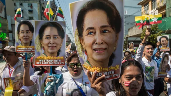 In this file photo taken on December 10, 2019 people participate in a rally in support of Myanmar's State Counsellor Aung San Suu Kyi, as she prepares to defend Myanmar at the International Court of Justice in The Hague against accusations of genocide against Rohingya Muslims. Myanmar's military has detained the country's de facto leader Aung San Suu Kyi and the country's president in a coup, a spokesman for her ruling party said February 1, 2021.  Sai Aung Main / AFP