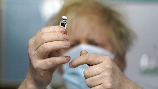 Britain has set itself an ambitious goal of vaccinating 15 million of the most vulnerable people by mid-February, and the entire adult population by the autumn. A total of 598,389 people in the UK received a first vaccine dose on Saturday, the highest daily figure since the rollout began.  Jon Super / POOL / AFP