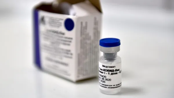 In this file photo taken on September 10, 2020 a vial with Russia's new coronavirus vaccine is seen prior to a vaccination of a volunteer in a post-registration trial, Moscow. Mexico authorized Russia's Sputnik V virus vaccine, the government informed on February 2, 2021. Natalia KOLESNIKOVA / AFP