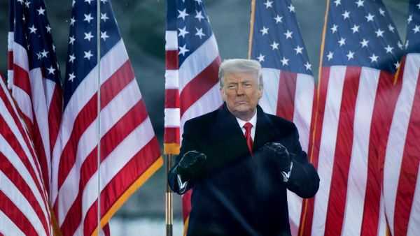  In this file photo taken on January 06, 2021, US President Donald Trump greets supporters on The Ellipse near the White House in Washington, DC. One year after his first impeachment, former president Donald Trump finds himself the subject of an unprecedented second trial beginning Tuesday in the Senate, whose members must determine whether he incited a deadly assault on the US Capitol. The 100 senators will also step into controversial, uncharted territory when they sit in judgment of a president who is no