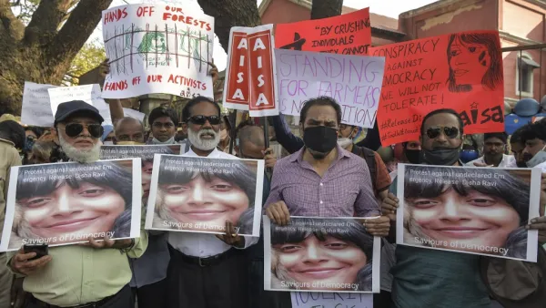 Activists belonging to various human rights organisations hold placards as they stage a demonstration against the arrest of the activist Disha Ravi by Delhi police for her alleged involvement in the instigation of violence during the farmers protest on India's Republic Day, in Bangalore on February 15, 2021. Manjunath Kiran / AFP
