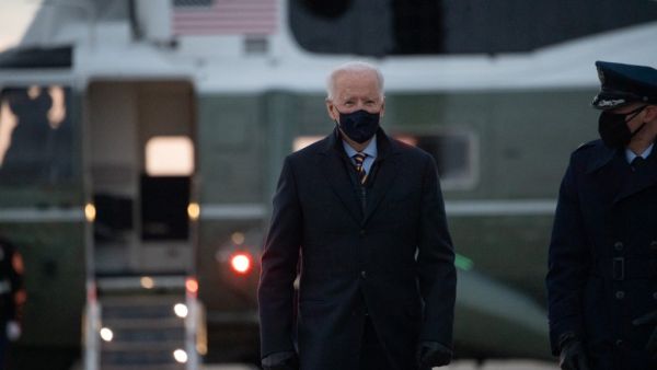 US President Joe Biden makes his way to board Air Force One prior to departure from Joint Base Andrews in Maryland, February 16, 2021, as he travels to Milwaukee, Wisconsin, for a town hall. SAUL LOEB / AFP