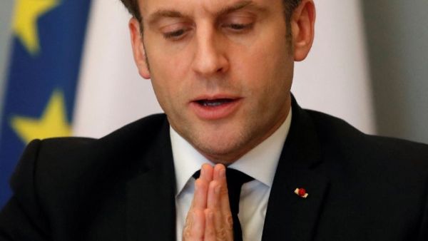French President Emmanuel Macron gestures as he speaks during a video conference meeting with African Union officials following the ACT-A initiative to coordinate a global and united response to the Covid-19 pandemic, at the Elysee Palace in Paris, on February 17, 2021. GONZALO FUENTES / POOL / AFP