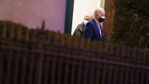 US President Joe Biden departs Holy Trinity Church in the Georgetown neighborhood of Washington, DC on February 20, 2021. MANDEL NGAN / AFP