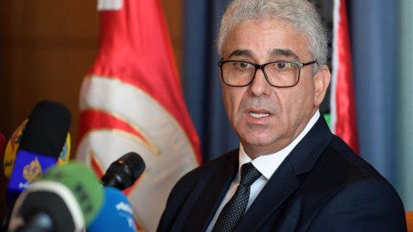  In this file photo taken on December 26, 2019 Fathi Bashagha, Libya's UN-recognised and Tripoli-based Government of National Accord (GNA) interior minister, gives a press conference in the Tunisian capital Tunis. The powerful interior minister of Libya's unity government survived an assassination attempt on February 21, 2021 on a highway near the capital Tripoli, an official from his inner circle told AFP. FETHI BELAID / AFP