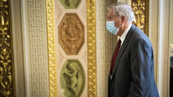 Sen. Lindsey Graham (R-SC) walks on the fourth day of the second impeachment trial of former President Donald Trump at the U.S. Capitol on February 12, 2021 in Washington, DC. Trump's defense team presented the defense that Trump should not be held responsible for the January 6th attack at the U.S. Capitol on first amendment grounds and the fact that he is no longer in office. Jabin Botsford - Pool/Getty Images/AFP
