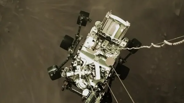 NASA shared an exciting image shot by the sky crane that shows Perseverance, nicknamed Perky, slung beneath and attached to mechanical bridals – moments before making landfall. NASA believes this image will become an iconic picture of spaceflight history. (NASA)