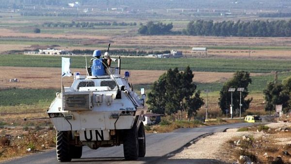 UN vehicles monitor the blue line 