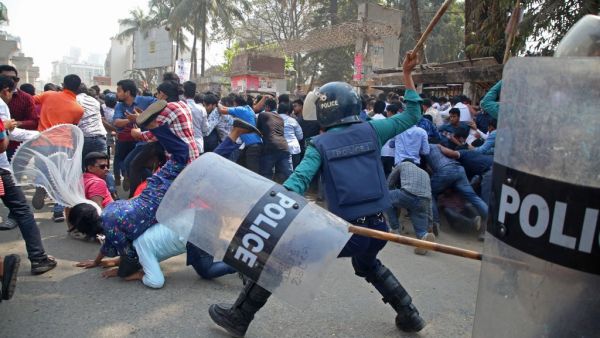 Policemen clash with the activists of Bangladesh Nationalist Party (BNP) during the third day of protests following the death of Mushtaq Ahmed, a prominent writer and government critic in jail, in front of the National Press Club in Dhaka on February 28, 2021. Sony Ramany / AFP Police clash with activists in Dhaka