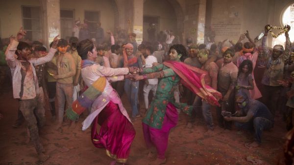 Hindu devotees take part in a traditional gathering during the Lathmar Holi celebrations