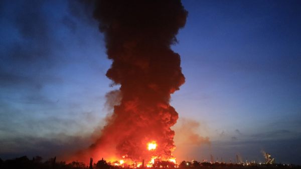 Massive fire rages at oil refinery