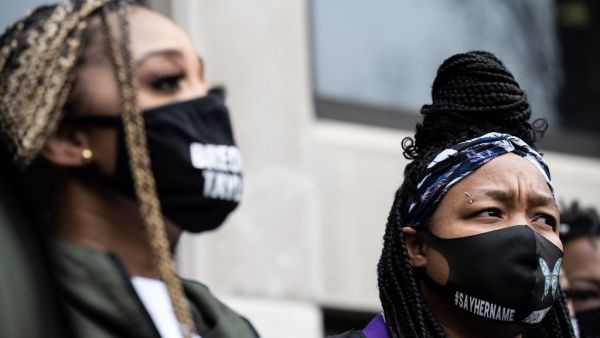 Tamika Mallory (L) speaks as Tamika Palmer listens
