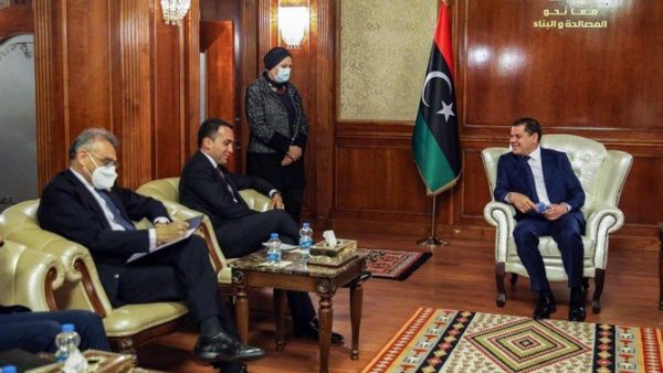 Italian Foreign Minister Luigi Di Maio (C)  with new Libyan PM Abdul Hamid Dbeibah (R)