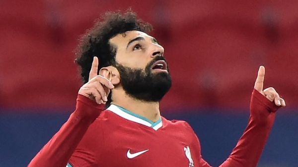 The Reds have booked a quarter-final spot in the Champions League, but their Egyptian forward admits domestic efforts in 2020-21 have been “tough” (Photo: AFP)