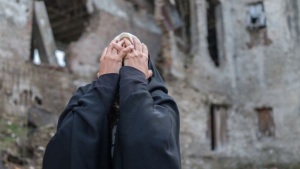 Desperate Syrian woman in destroyed city