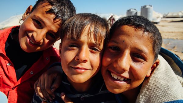 Syrian children pose for the camera at the Zaatari refugee camp in Mafraq, Jordan