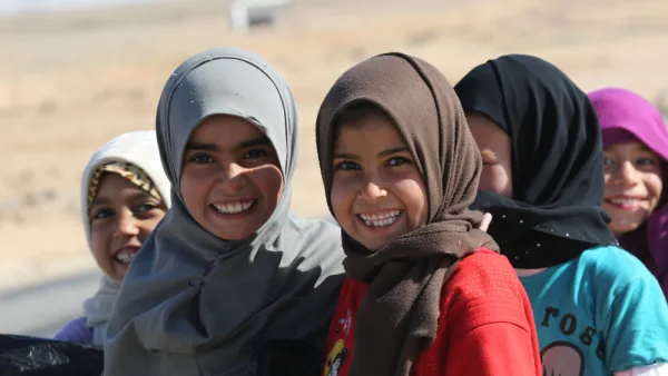 Syrian kids say cheese at Jordan's Zaatari Refugee Camp
