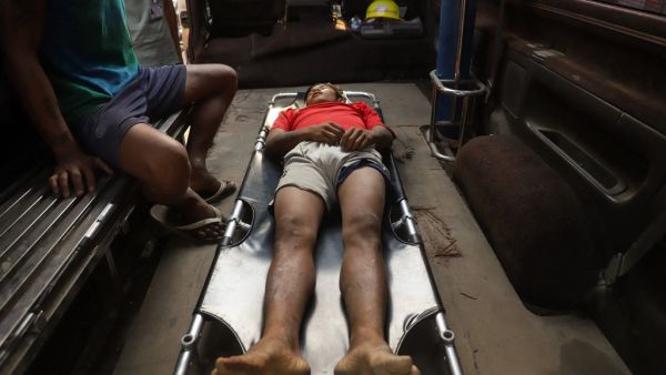 The body of Zaw Ko Latt, a protester shot dead is laid out on a stretcher in a vehicle in Mandalay 