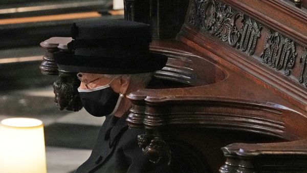 Britain's Queen Elizabeth II sits alone in the quire of St George's Chapel