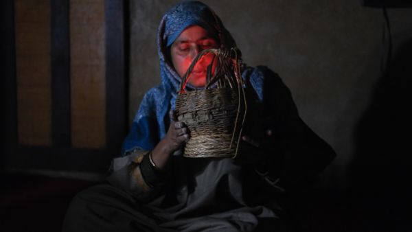 Kashmiri Kangri (Kanger) heater is being fired up by a housewife