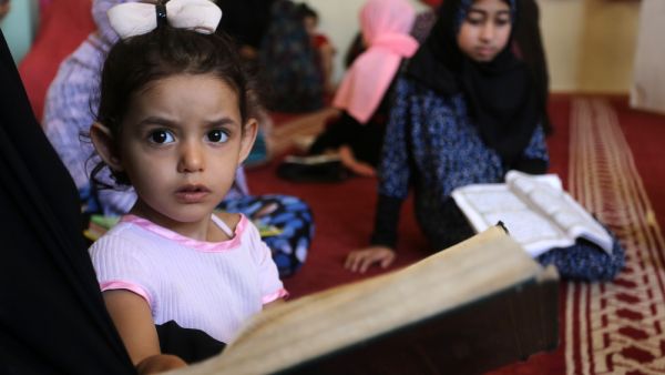 students attend a Quran course