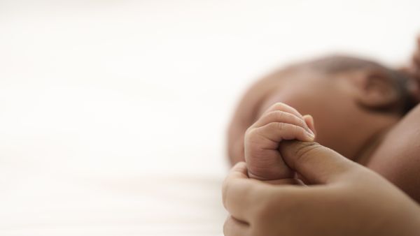 Close up of infant baby hand