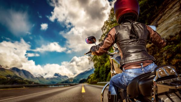Biker girl rides a motorcycle 