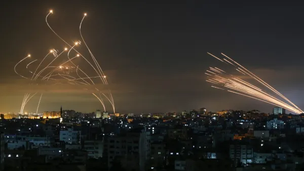 Rockets are seen in the night sky fired towards Israel from Beit Lahia in the northern Gaza Strip 