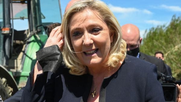French far-right party of the National Rally (RN) President and Member of Parliament Marine Le Pen looks on in Saint-Gilles, south of France on May 20, 2021, during a visit to a wine and rice farm to show her support for the RN candidate Jean-Paul Garraud, head of the list for the regional elections in Occitanie