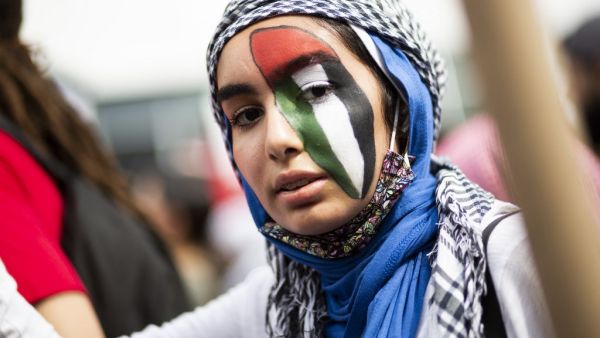A woman attends a protest in support of Palestine in Queens in New York on May 22, 2021. Gazans tried to piece back their lives Saturday after a devastating 11-day conflict with Israel that killed more than 200 people and made thousands homeless in the impoverished Palestinian enclave. US President Joe Biden pledged to help organise efforts to rebuild Gaza and said creating a Palestinian state alongside Israel is the "only answer" to the conflict