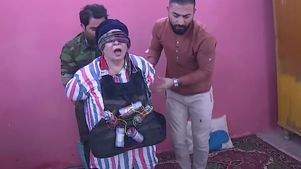 The terrified actress, pictured with a fake suicide vest, was terrified and kept praying and screaming as she was led outside 