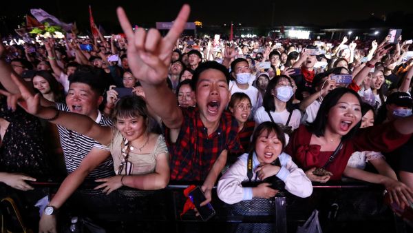 Thousands of revellers bounce and scream with delight at the Strawberry Music Festival in China's Wuhan city