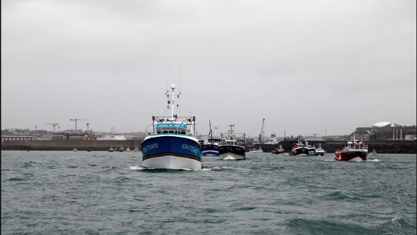 Military boat sent to save fishing vessels blockade the harbour