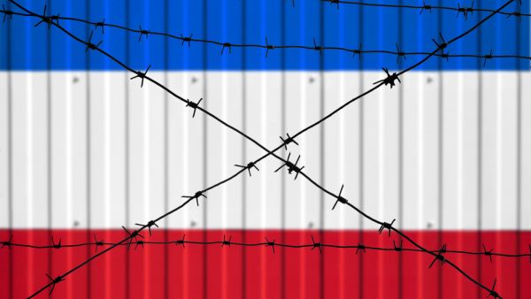 National flag of France on fence