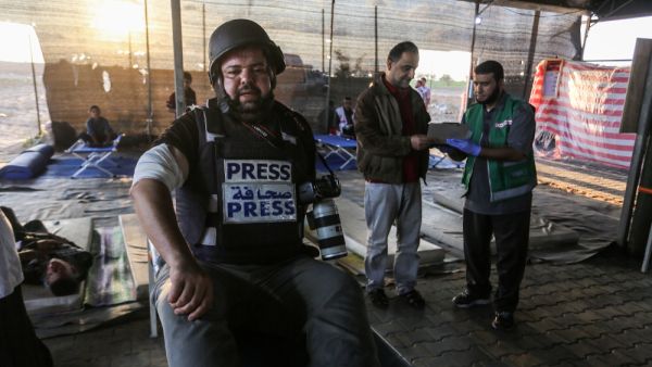 Photo-journalist Abed Rahim Khatib gets injured in his hand after Israeli forces' intervention during the "Great March of Return" rally at Israel-Gaza border in Gaza City