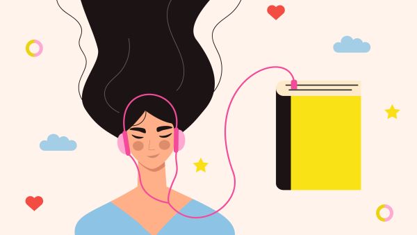 Beautiful young girl in headphones listening to audiobook.