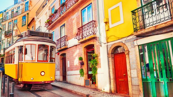 Yellow vintage tram on the street in Lisbon, Portugal