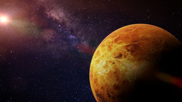 planet Venus in front of a colorful star field 