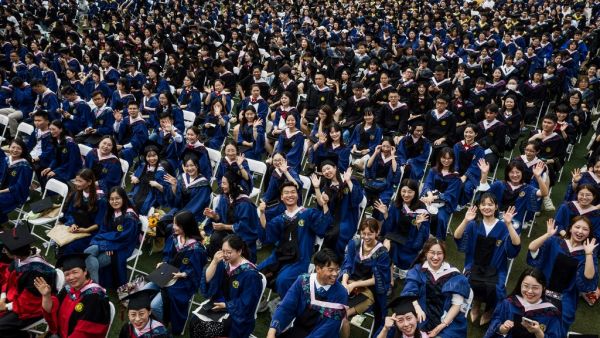 This photo taken on June 13, 2021 shows nearly 11,000 graduates, including more than 2000 students who could not attend the graduation ceremony last year due to the Covid-19 