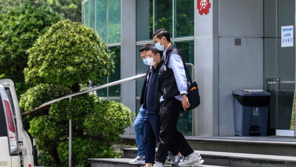 Apple Daily journalists were held for publishing articles urging foreign nations to impose sanctions on China.