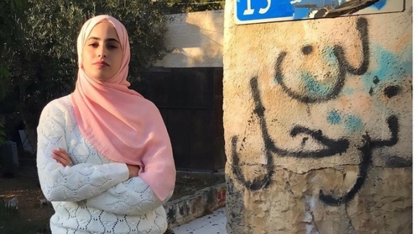 Israeli army forces arrest Muna al-Kurd on Sunday morning.