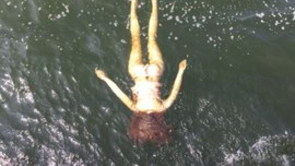 The doll was floating upside down on the water, leading passersby to alert the emergency services