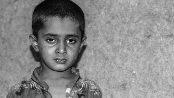 child with sad face expression is crying 