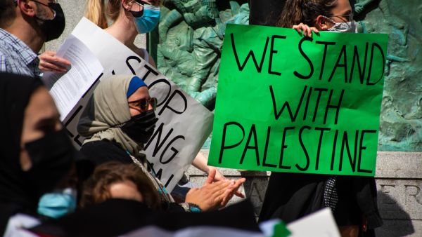 Protesters in a rally with Palestinian flags