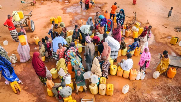 African people waiting to get in the water.