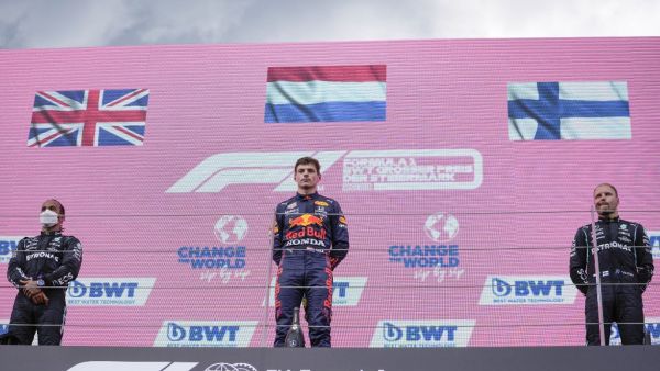(L-R) Second placed Mercedes' British driver Lewis Hamilton, winner Red Bull's Dutch driver Max Verstappen and third placed Mercedes' Finnish driver Valtteri Bottas look on during the podium ceremony of the Formula One Styrian Grand Prix at the Red Bull Ring race track in Spielberg, Austria. (Photo: AFP)